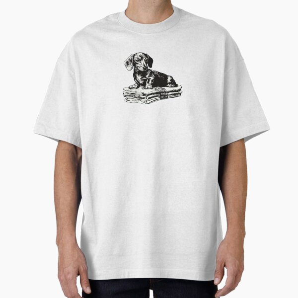 Cute dog sits on stacked blankets T-Shirt
